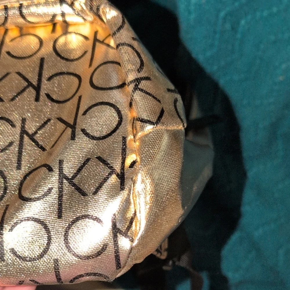 Calvin Klein Metallic Gold Backpack with Black Logo